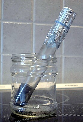 test tube with secured foil cap